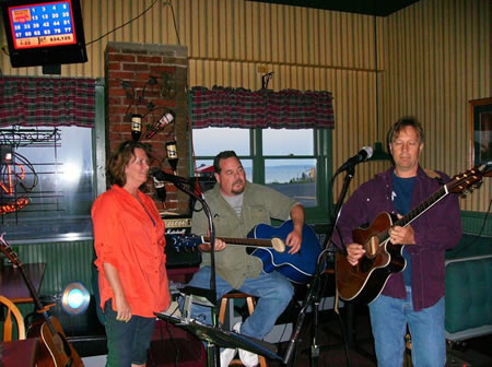 Singers and guitar players at Open Mic night at the Village Inn